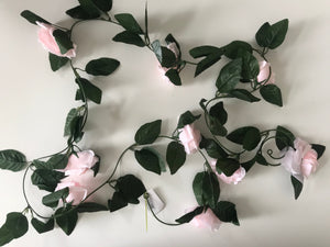 Artificial rose flower garland with pale faux pink flowers